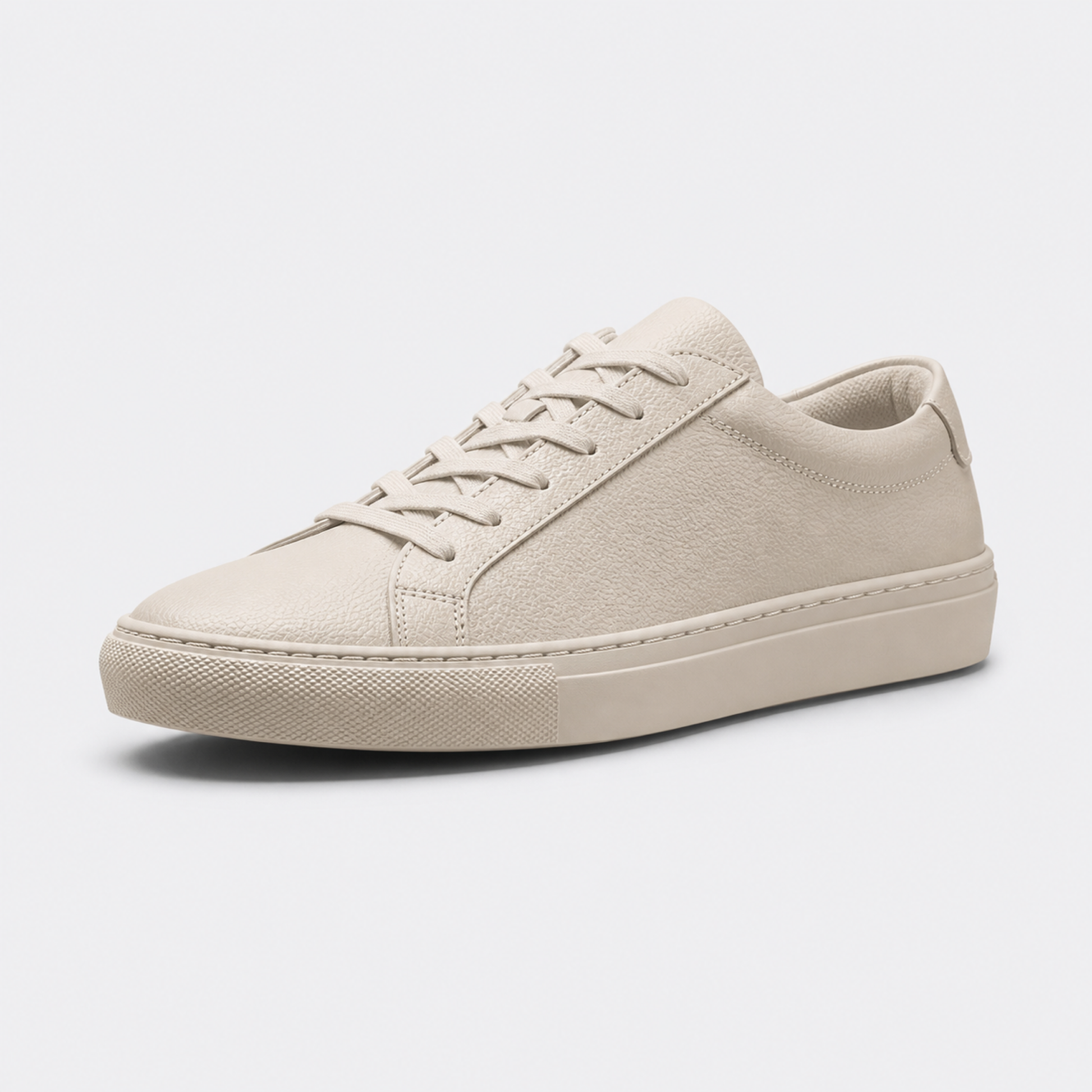 Beige classic leather low-top sneaker three-quarter view