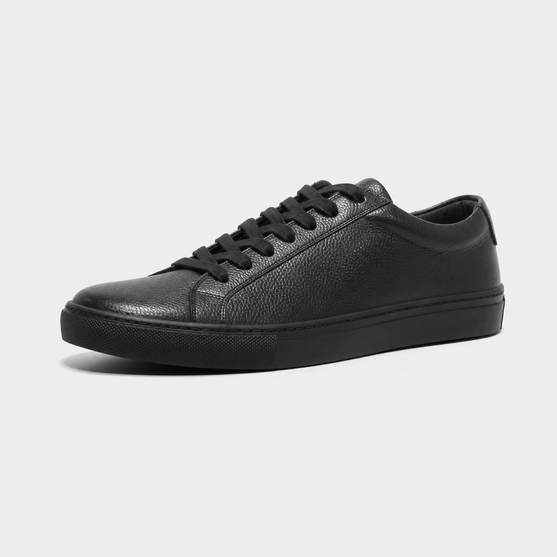 Black classic leather low-top sneaker three-quarter view