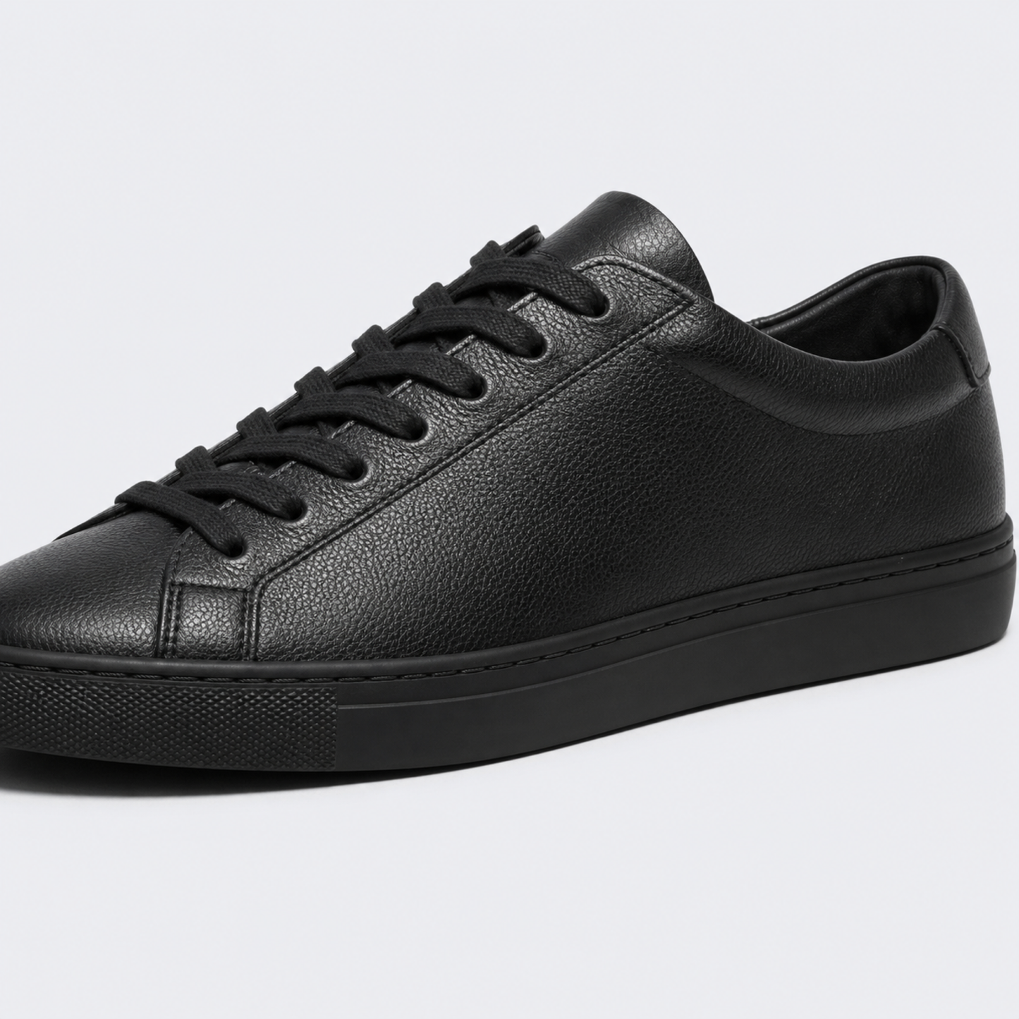 Black classic leather low-top sneaker leather and construction detail