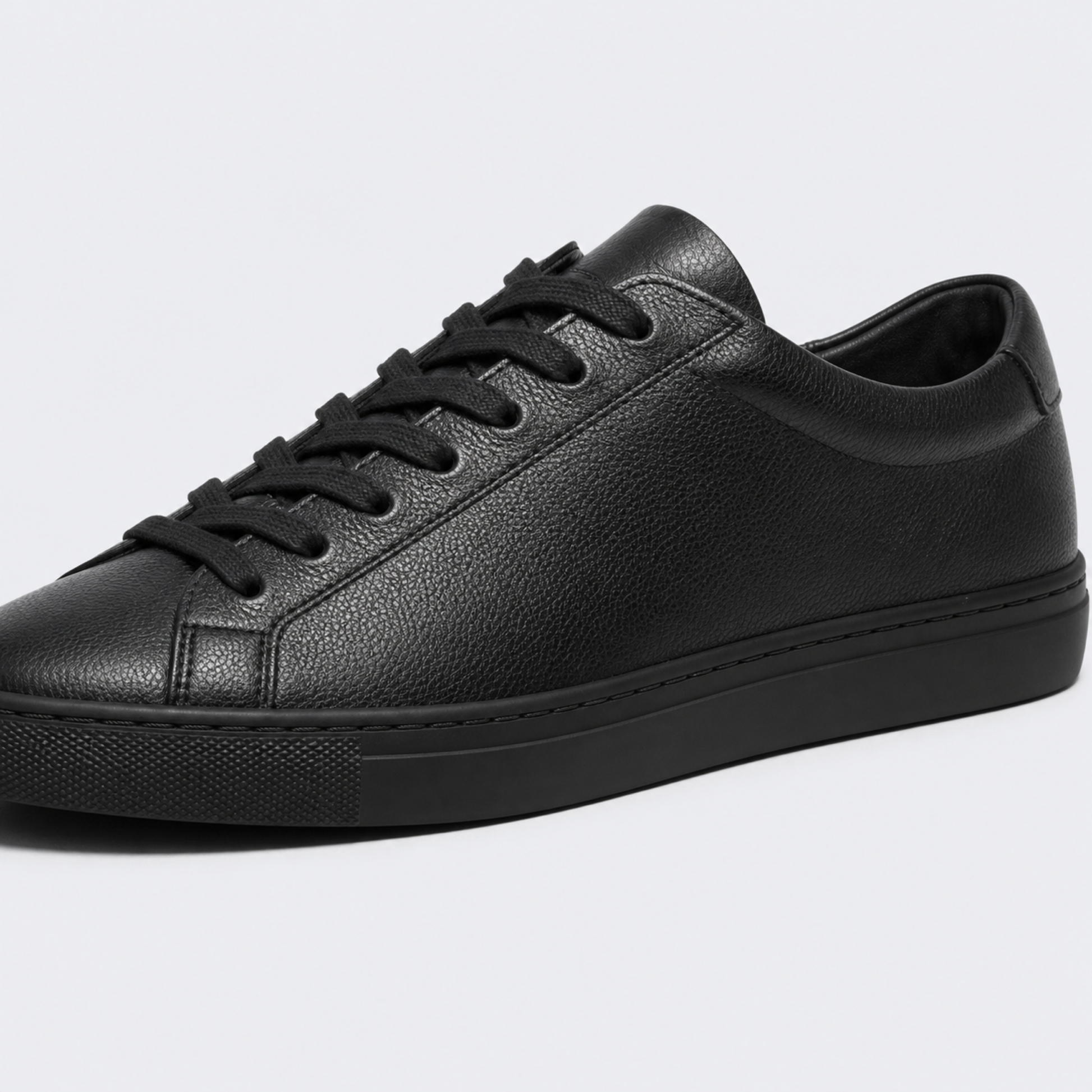 Black classic leather low-top sneaker leather and construction detail