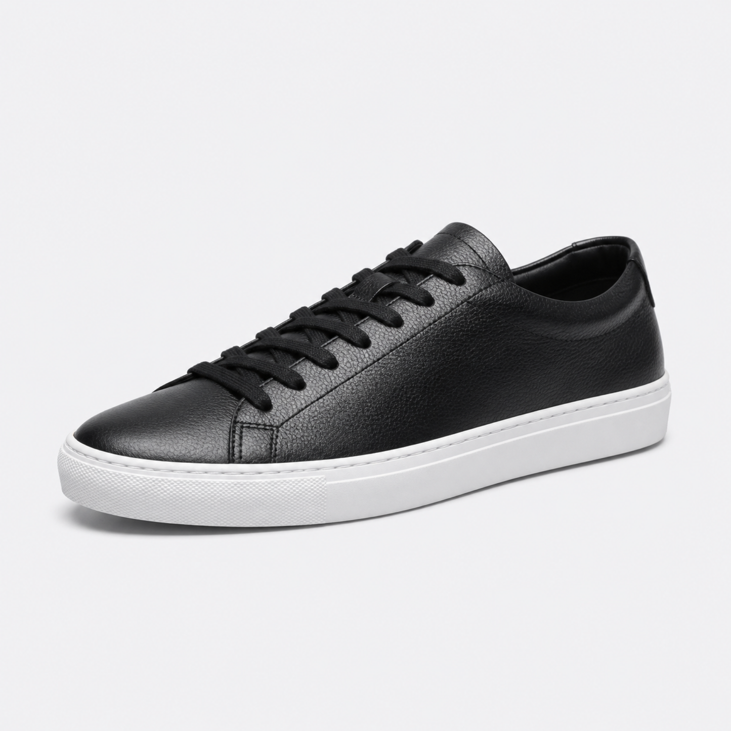 Black / White Sole classic leather low-top sneaker three-quarter view