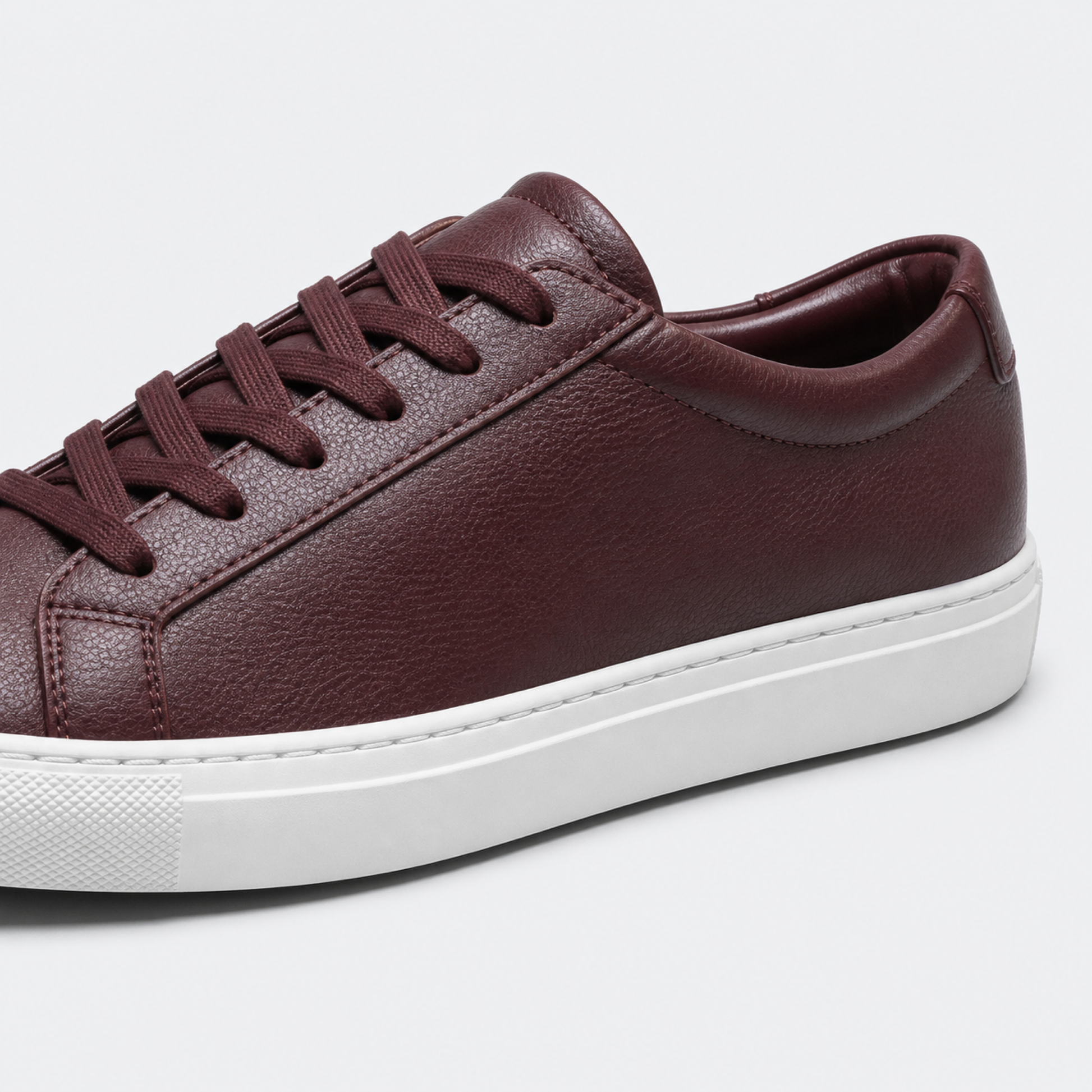 Bordeaux / White Sole classic leather low-top sneaker leather and construction detail